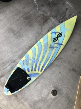 6’4” Estrada mini gun surfboard